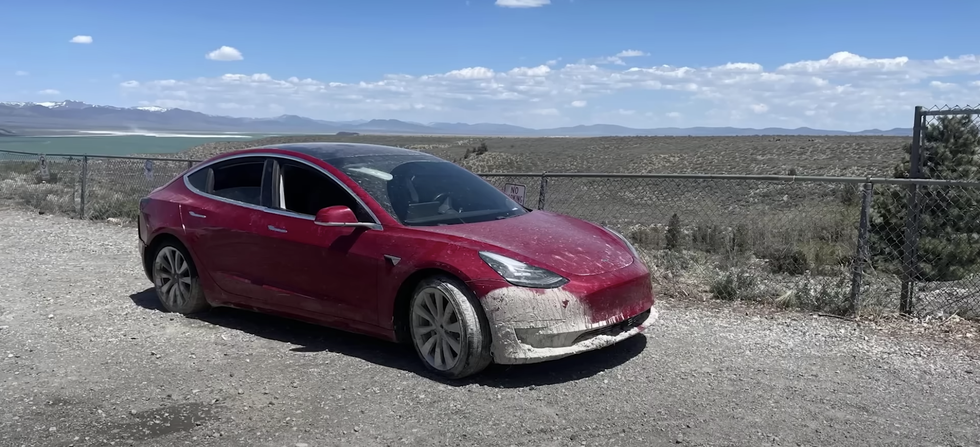 tesla model 3 crashed in puddle while using fsd beta on the side of the road after recovery efforts